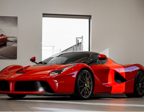 Cosmo Sunshield film applied to a red sports car